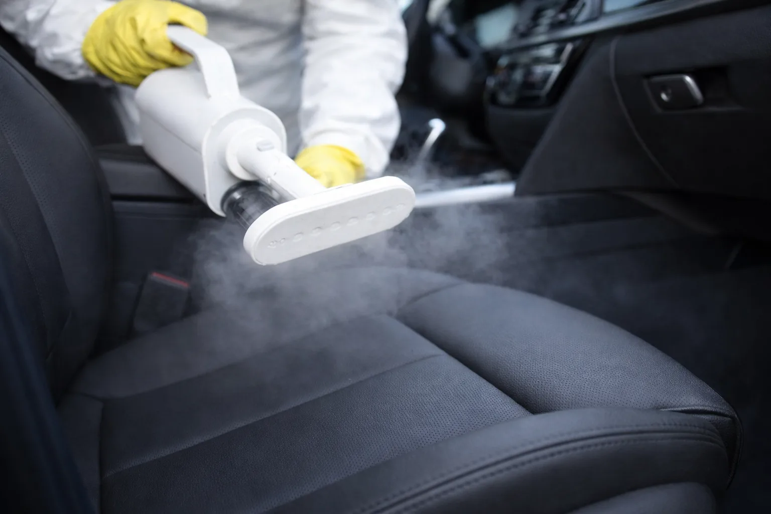 Professional car mould removal using steam cleaning on car seats.